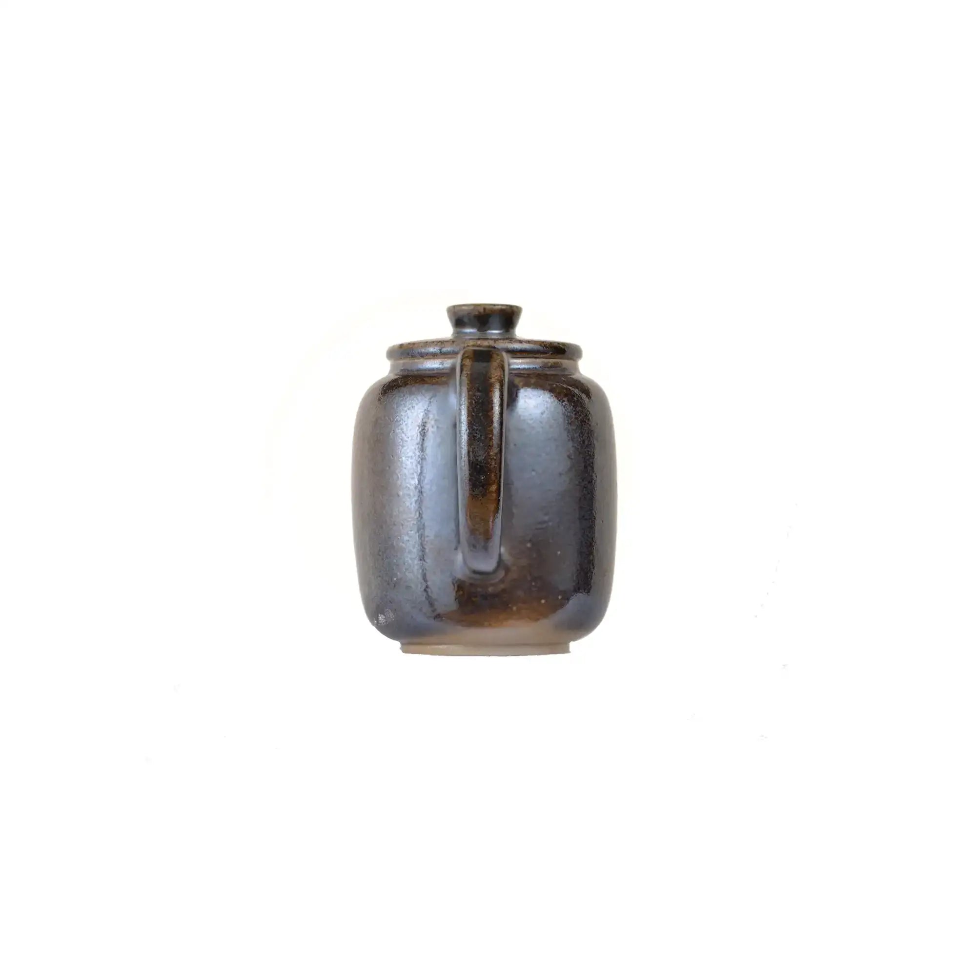 Back view of PorSva No.66 wood-fired clay teapot showing natural firing variations