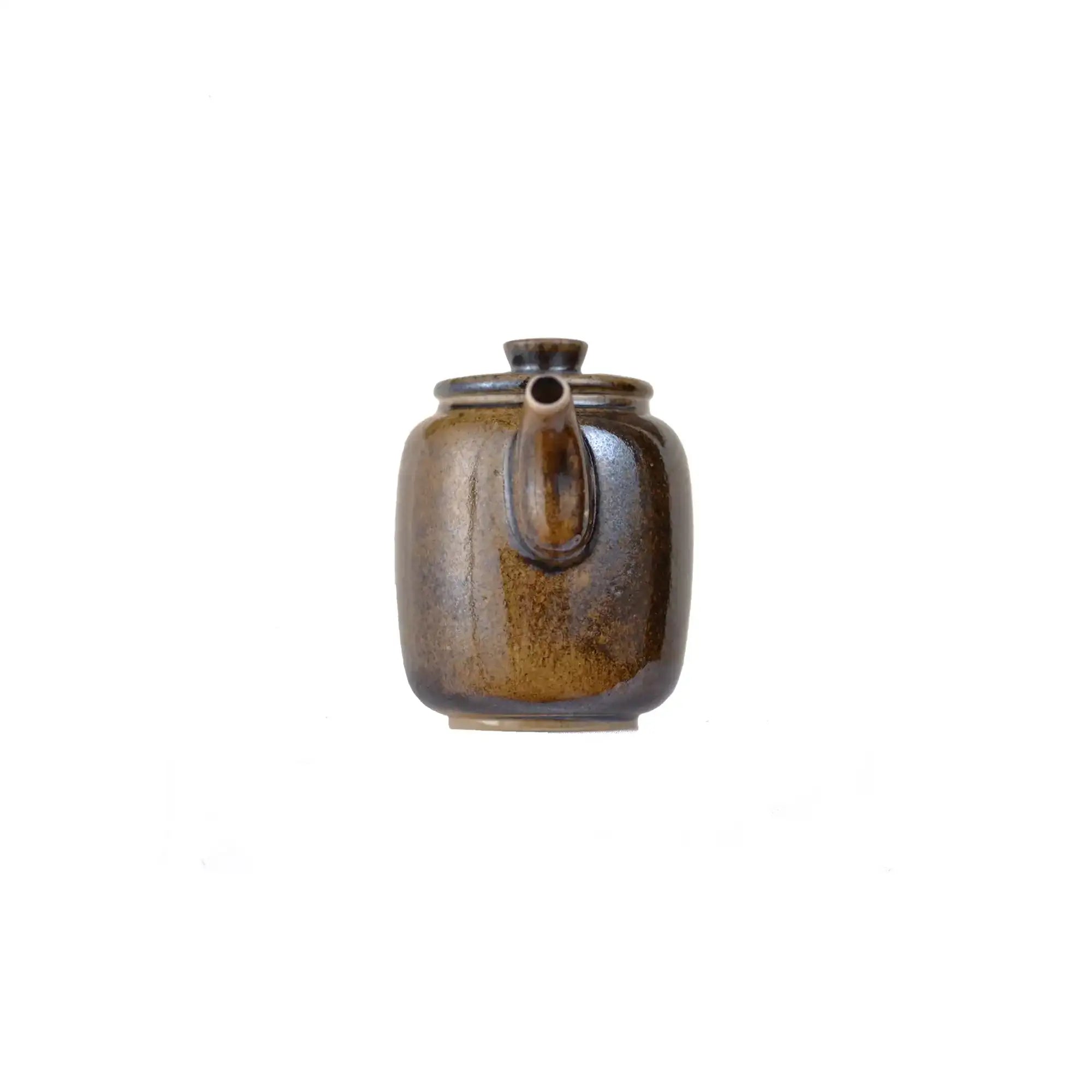 Front view of PorSva No.66 wood-fired clay teapot showing natural kiln firing marks