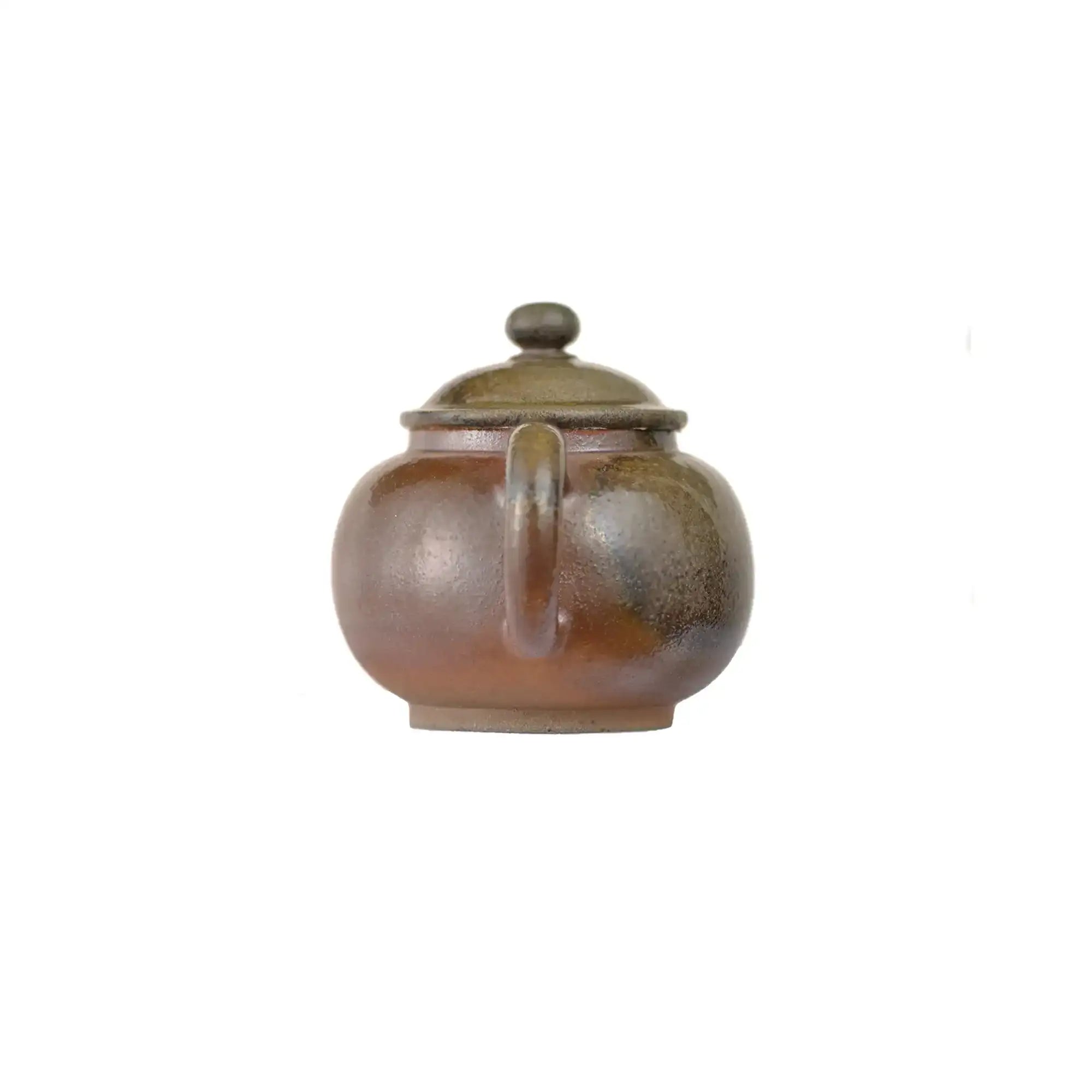 Back view of PorSva No.46 wood-fired clay teapot displaying natural kiln transformation
