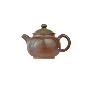 Left side view of PorSva No.46 wood-fired clay teapot showing natural kiln ash texture