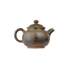 Right side view of PorSva No.46 wood-fired clay teapot highlighting unique natural firing marks