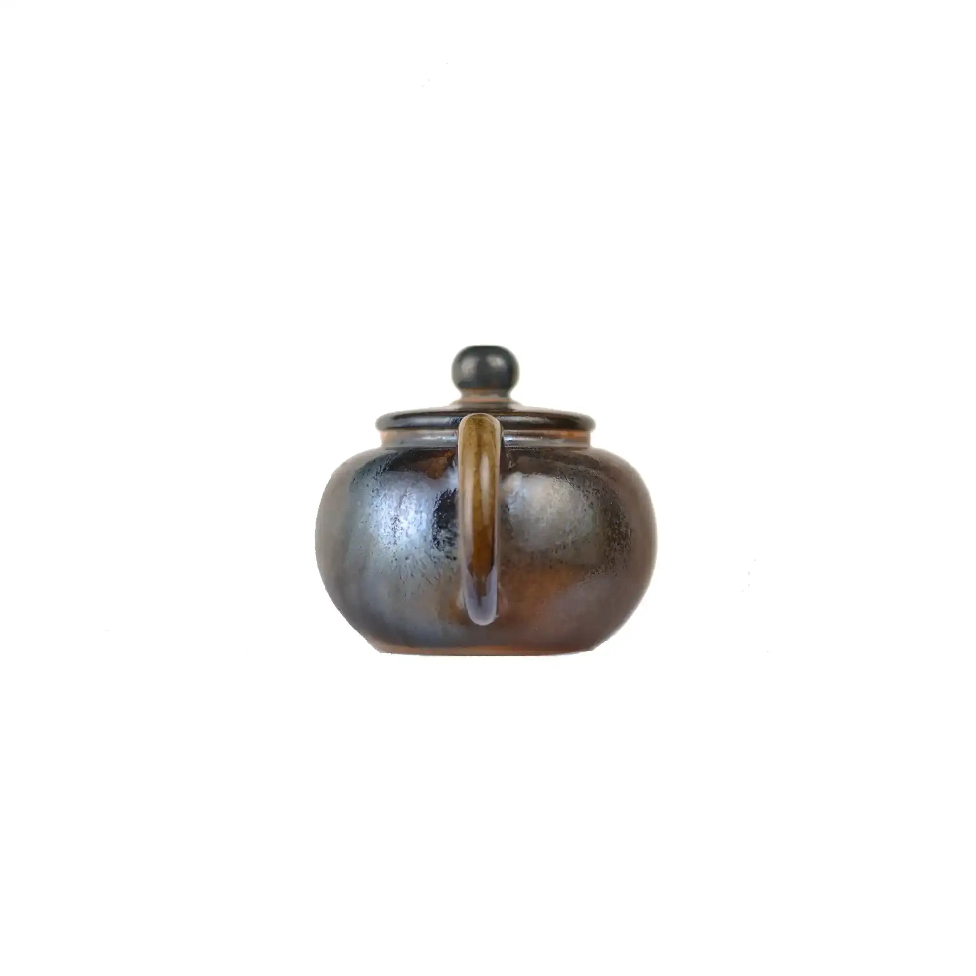 Back view of PorSva No.63 wood-fired  clay teapot showing natural firing variations