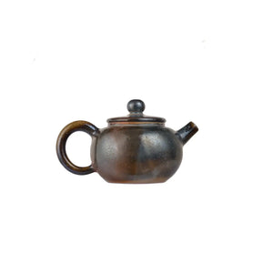 Right side view of PorSva No.63 wood-fired clay teapot highlighting kiln-fired surface texture