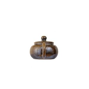 Back view of PorSva No.64 wood-fired clay teapot showing natural firing variations