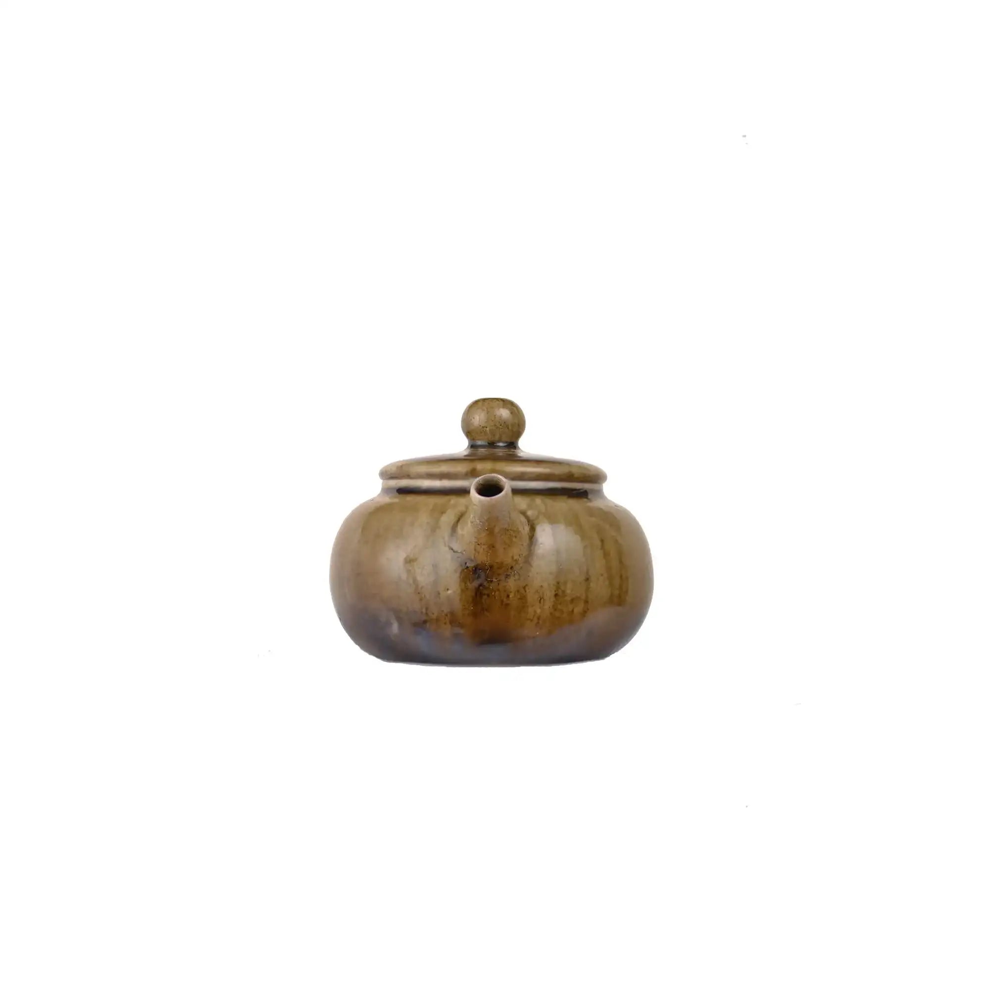 Front view of PorSva No.64 wood-fired clay teapot showing natural kiln firing marks