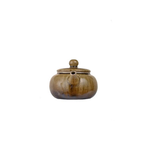 Front view of PorSva No.64 wood-fired clay teapot showing natural kiln firing marks
