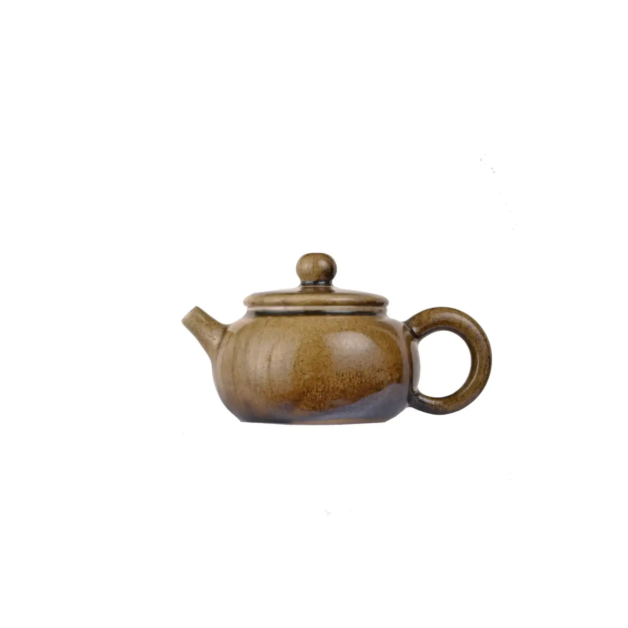 Left side view of PorSva No.64 wood-fired clay teapot with natural ash firing effects