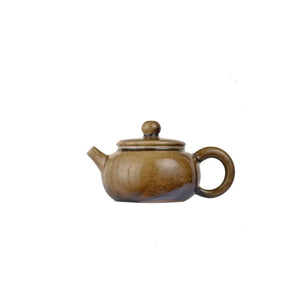 Left side view of PorSva No.64 wood-fired clay teapot with natural ash firing effects