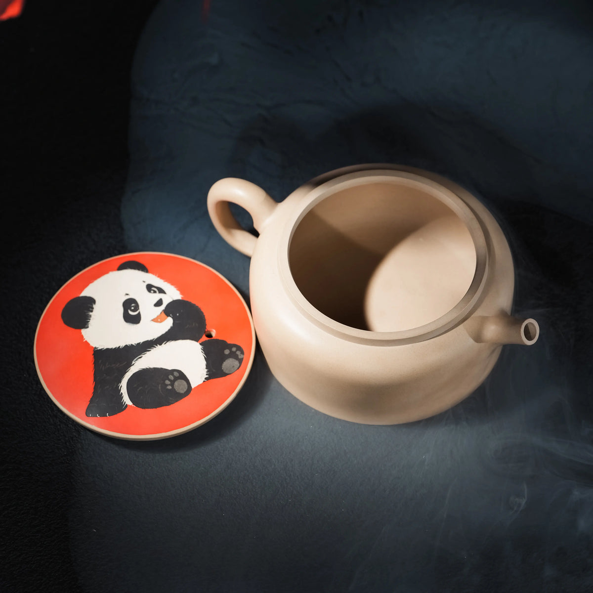 Jianshui panda teapot with decorated lid removed showing the opening