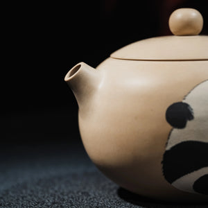 Carved and clay-inlaid panda motif on Jianshui teapot
