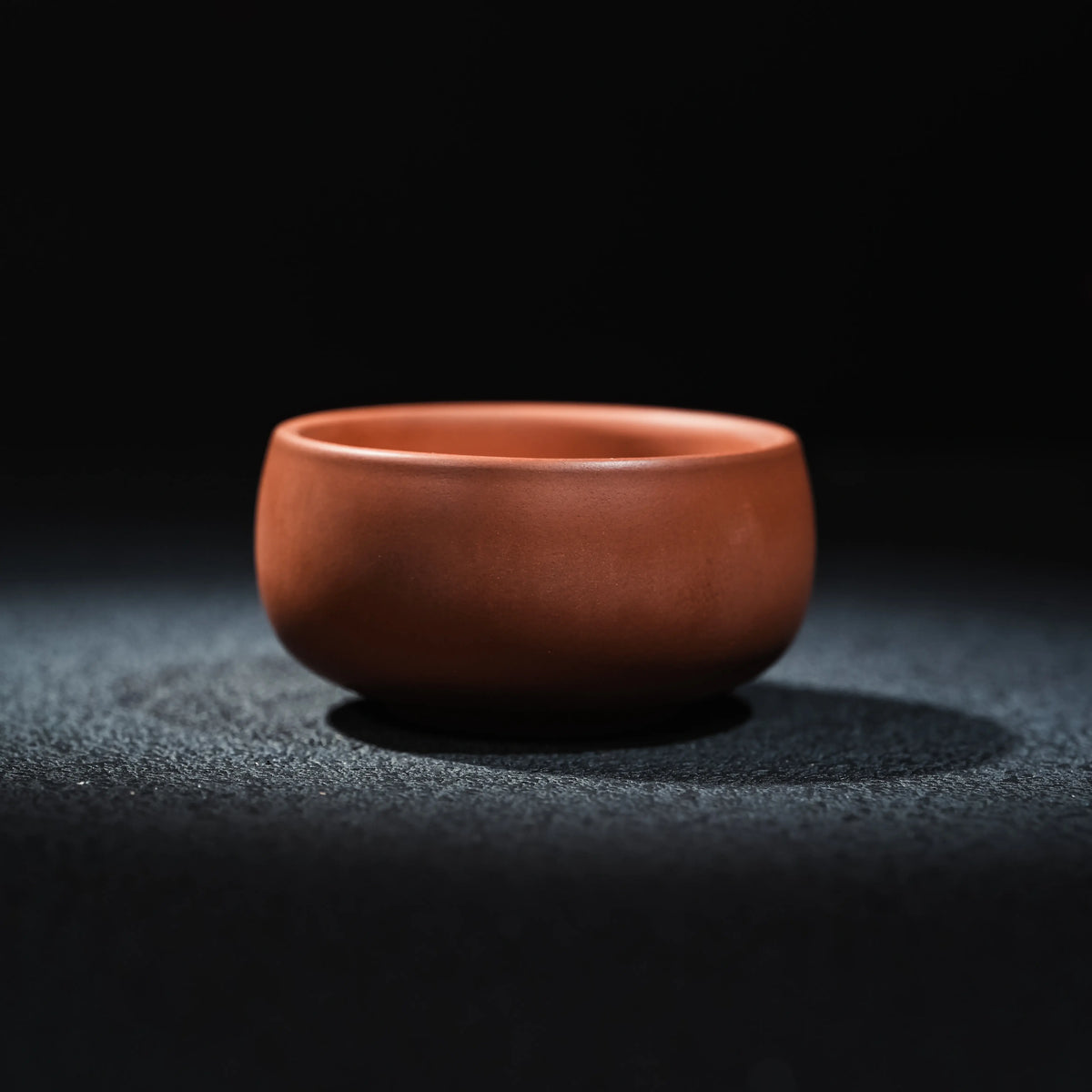 Side view of Jianshui plain red clay tea cup, 60ml