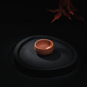 Handmade Jianshui red clay tea cup with hammered texture
