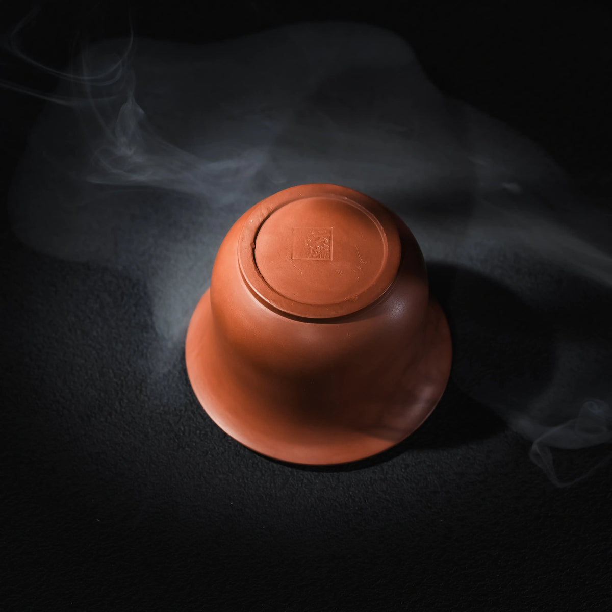 Bottom view of handmade Jianshui red clay handleless teapot