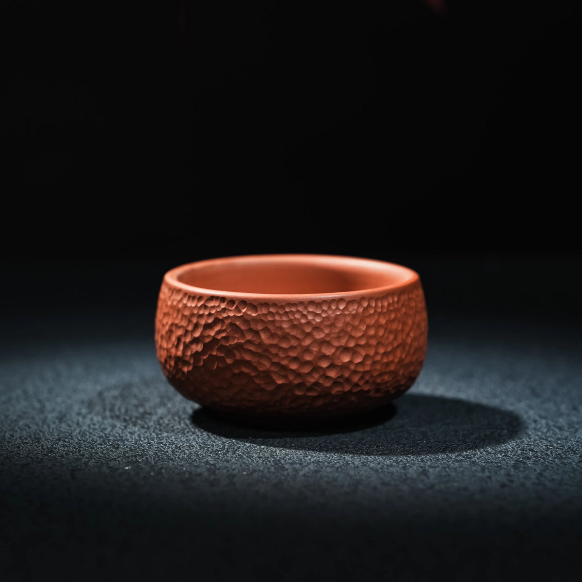 Side view of Jianshui red clay textured tea cup, 60ml
