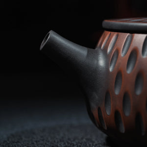 Carved texture detail on handmade Jianshui clay teapot