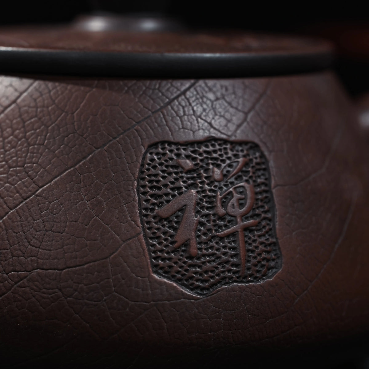 Close view of relief decoration on handmade Jianshui teapot