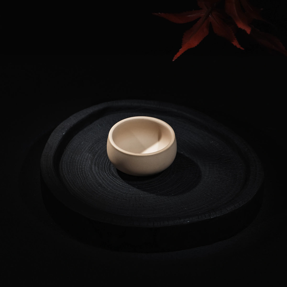 Handmade Jianshui white clay tea cup with textured surface