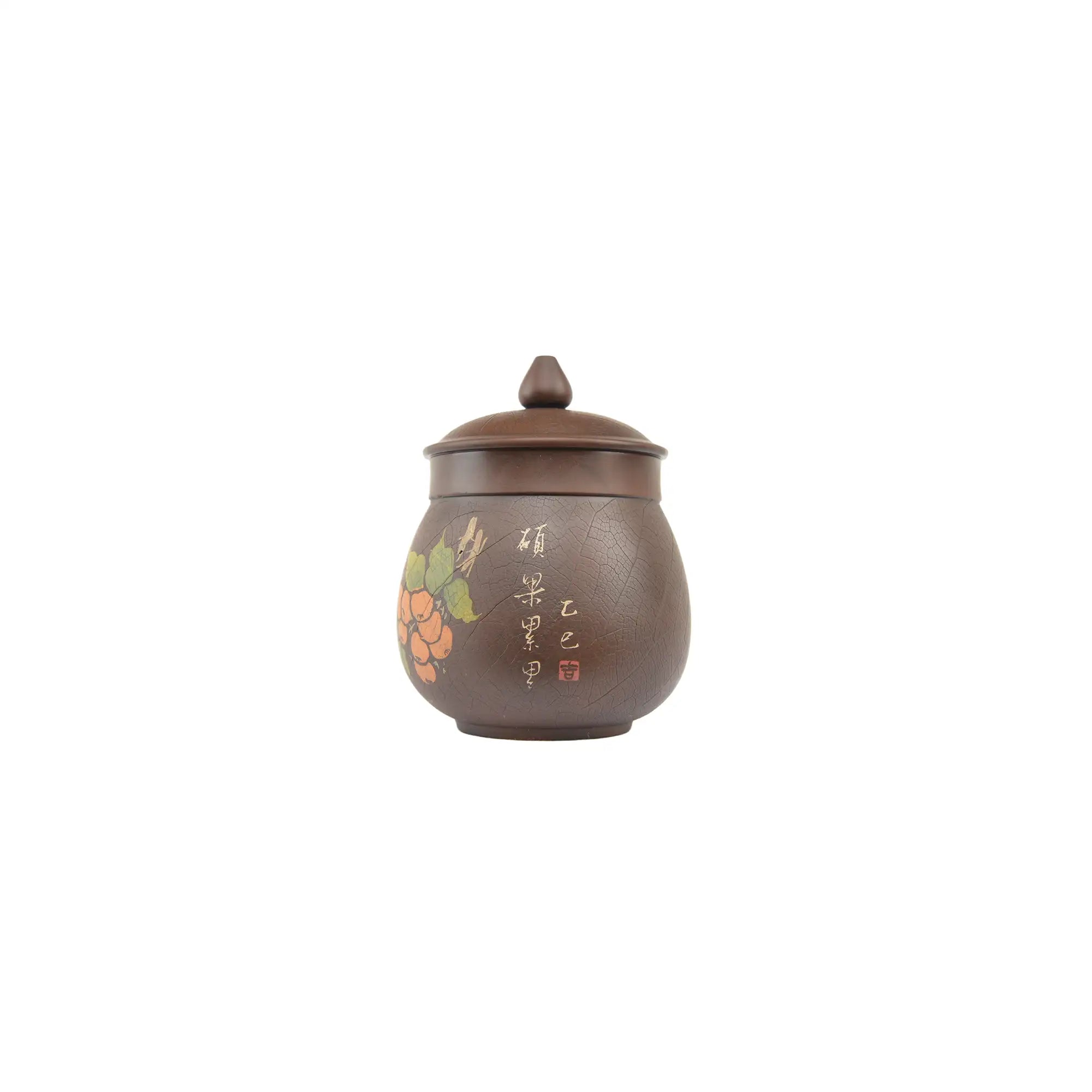Front view of Jianshui Zitao pottery cup featuring persimmon design created with Yin-carving and Yang-filling