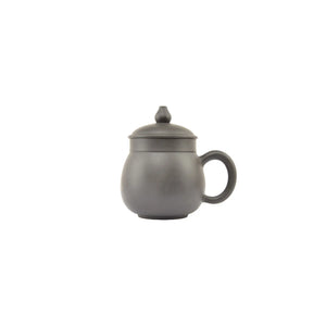 Plain side view of Jianshui Zitao pottery mug with natural unglazed clay surface, no pattern