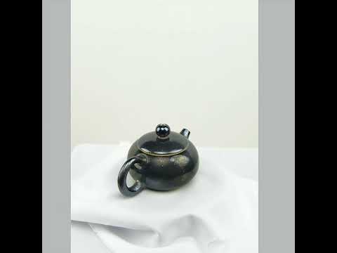 360° rotating view of PorSva No.61 wood-fired Jianshui clay teapot showing natural kiln effects