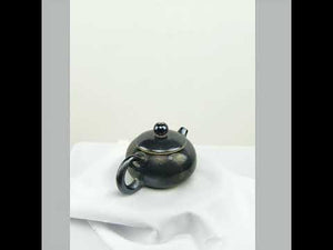 360° rotating view of PorSva No.61 wood-fired Jianshui clay teapot showing natural kiln effects