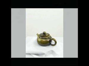 360° rotating view of PorSva No.64 wood-fired Jianshui clay teapot showing natural kiln effects
