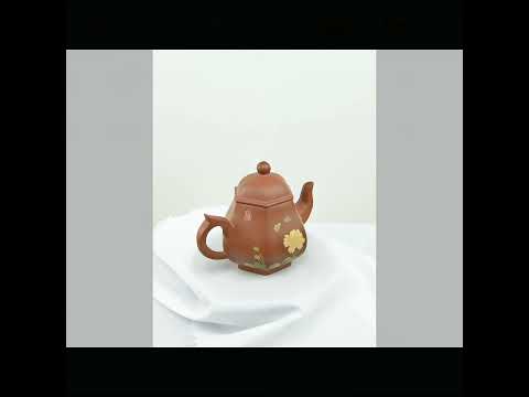 360° rotating view of PorSva No.55 hexagonal red Jianshui clay teapot with floral and calligraphy carving