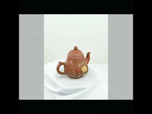 360° rotating view of PorSva No.55 hexagonal red Jianshui clay teapot with floral and calligraphy carving