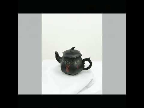 360° rotating view of PorSva No.55 hexagonal red Jianshui clay teapot with floral and calligraphy carving