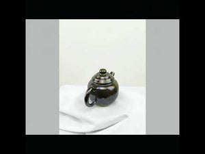 360° rotating view of PorSva No.65 wood-fired Jianshui clay teapot showing natural kiln effects