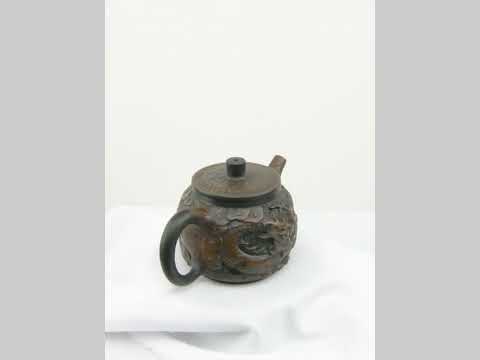 360° rotating view of PorSva No.33 Hanwa fully carved dragon clay teapot