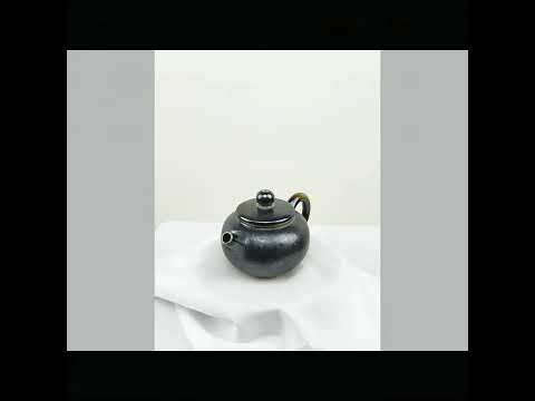 360° rotating view of PorSva No.63 wood-fired Jianshui clay teapot showing natural kiln effects