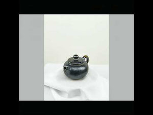 360° rotating view of PorSva No.63 wood-fired Jianshui clay teapot showing natural kiln effects