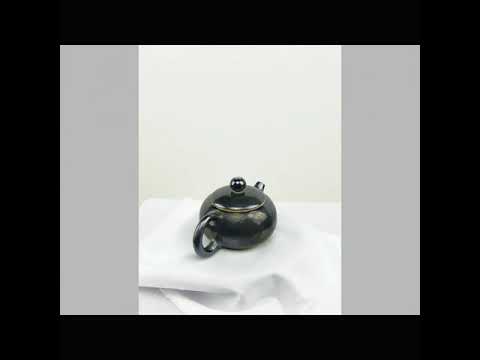 360° rotating view of PorSva No.62 wood-fired Jianshui clay teapot showing natural kiln effects