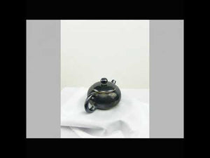 360° rotating view of PorSva No.62 wood-fired Jianshui clay teapot showing natural kiln effects