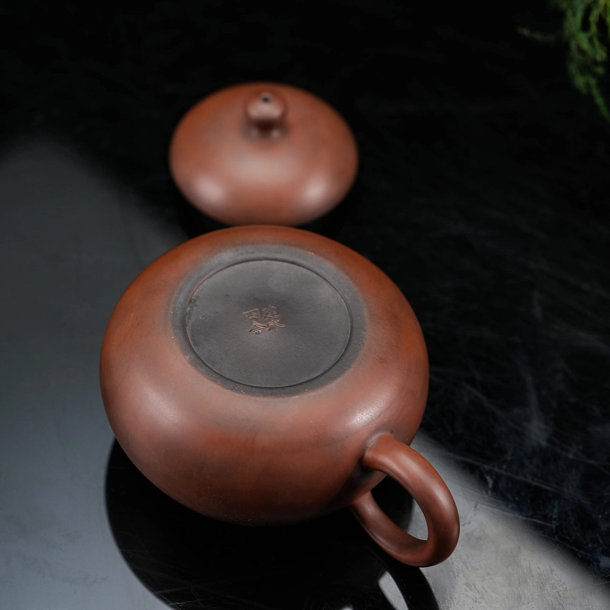 Bottom view of handmade Jianshui red clay teapot