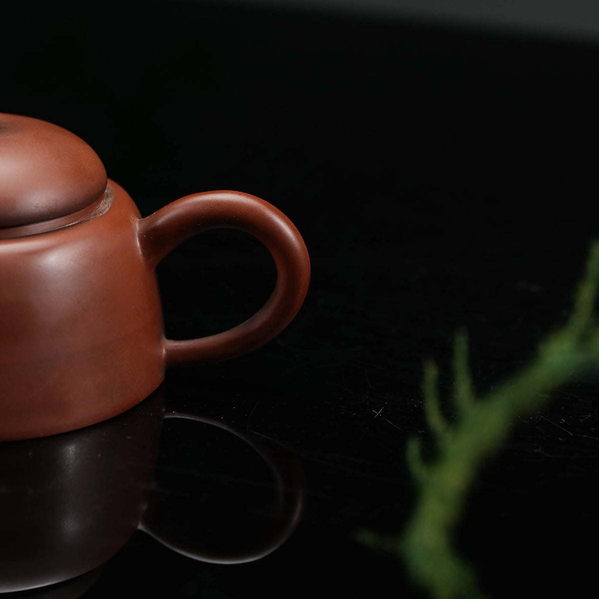 Handle detail of Jianshui plain red clay teapot