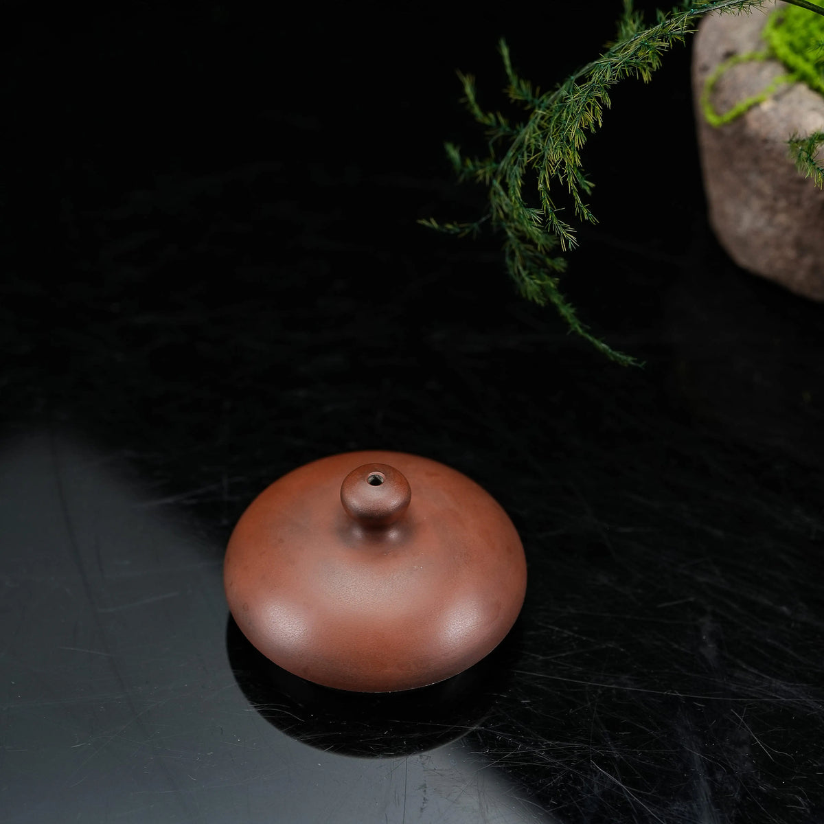 Top view of the lid on Jianshui rounded red clay teapot