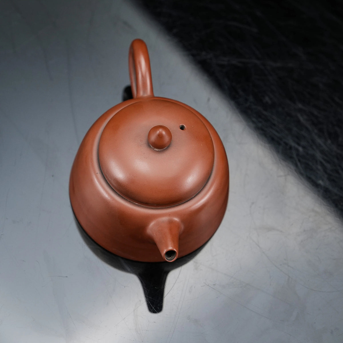 Top view of handmade Jianshui red clay teapot