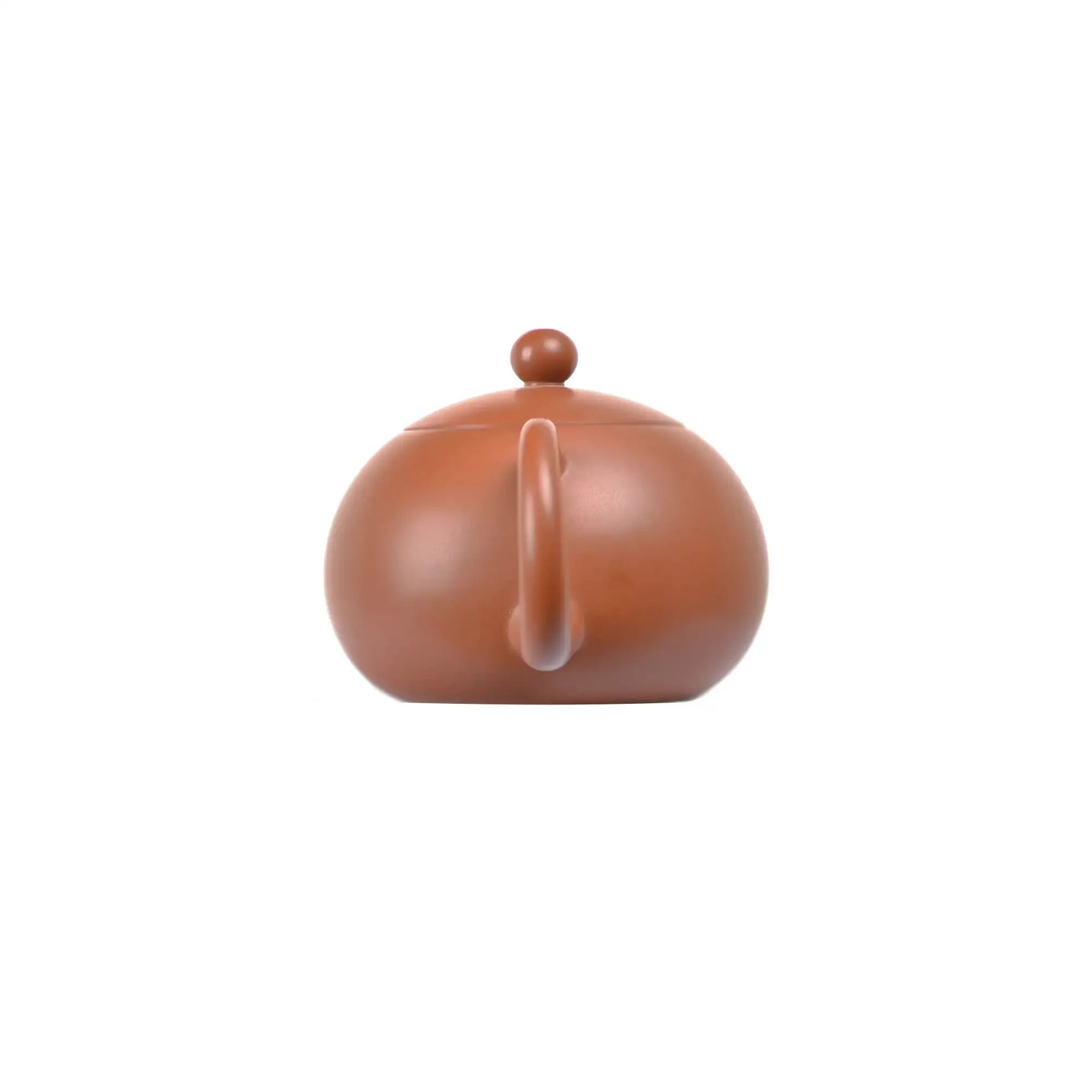 Back view of PorSva No.50 plain red clay teapot emphasizing natural clay surface