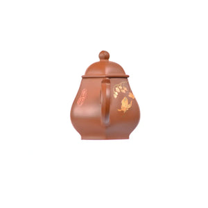 Back view of PorSva No.54 hexagonal red clay teapot highlighting geometric six-sided form