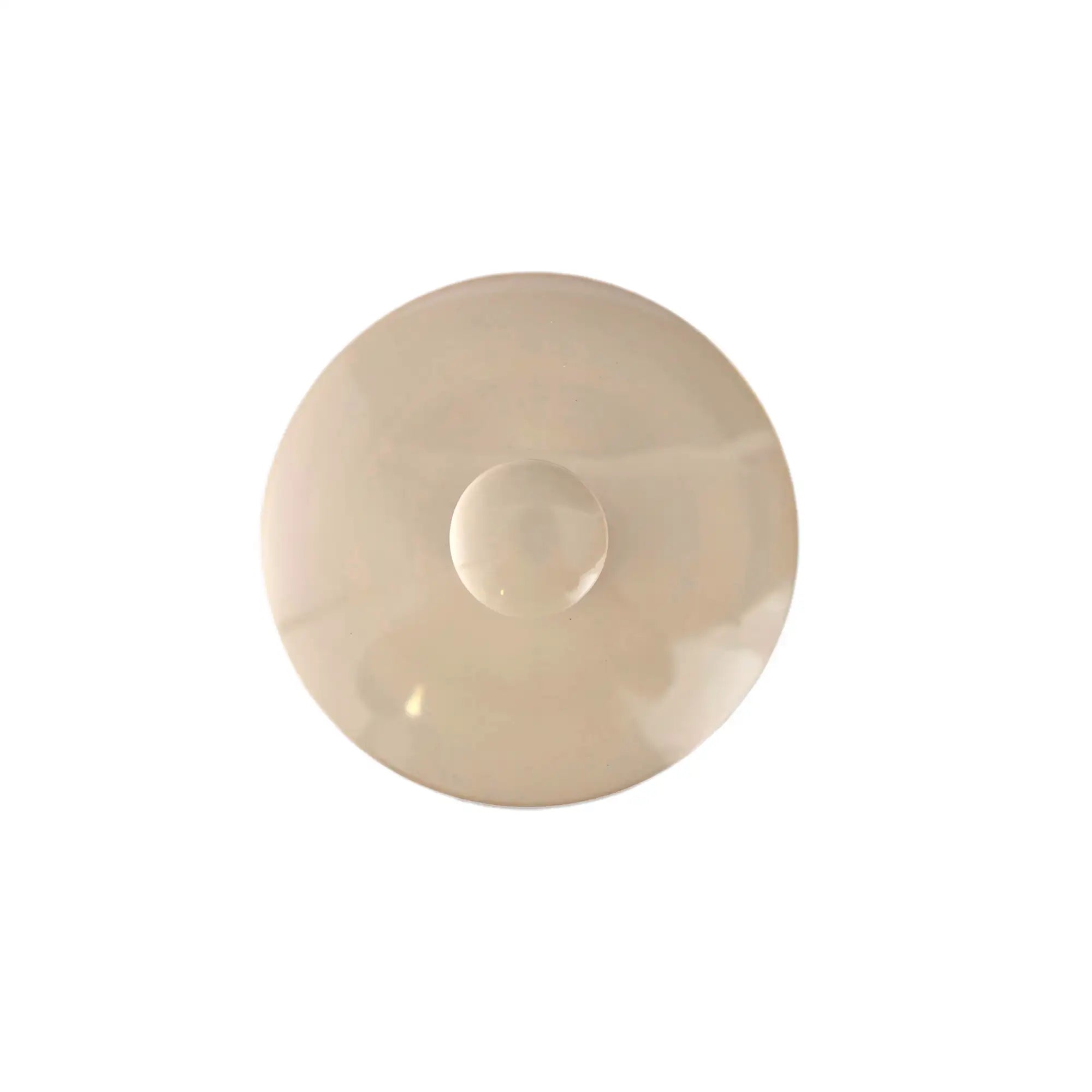 Top view of a handmade pottery tea canister lid with unglazed burnished surface.
