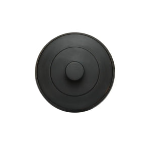 Top view of the tea canister lid, featuring a smooth matte black finish with concentric circular lines and a centered round knob.
