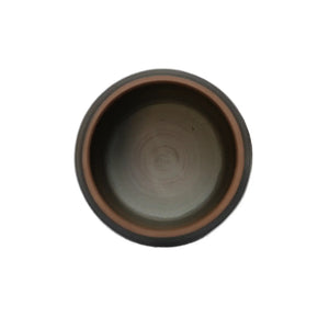 Interior view of the unglazed tea canister, showing a smooth hand-polished interior with natural clay tones and subtle circular throwing marks.