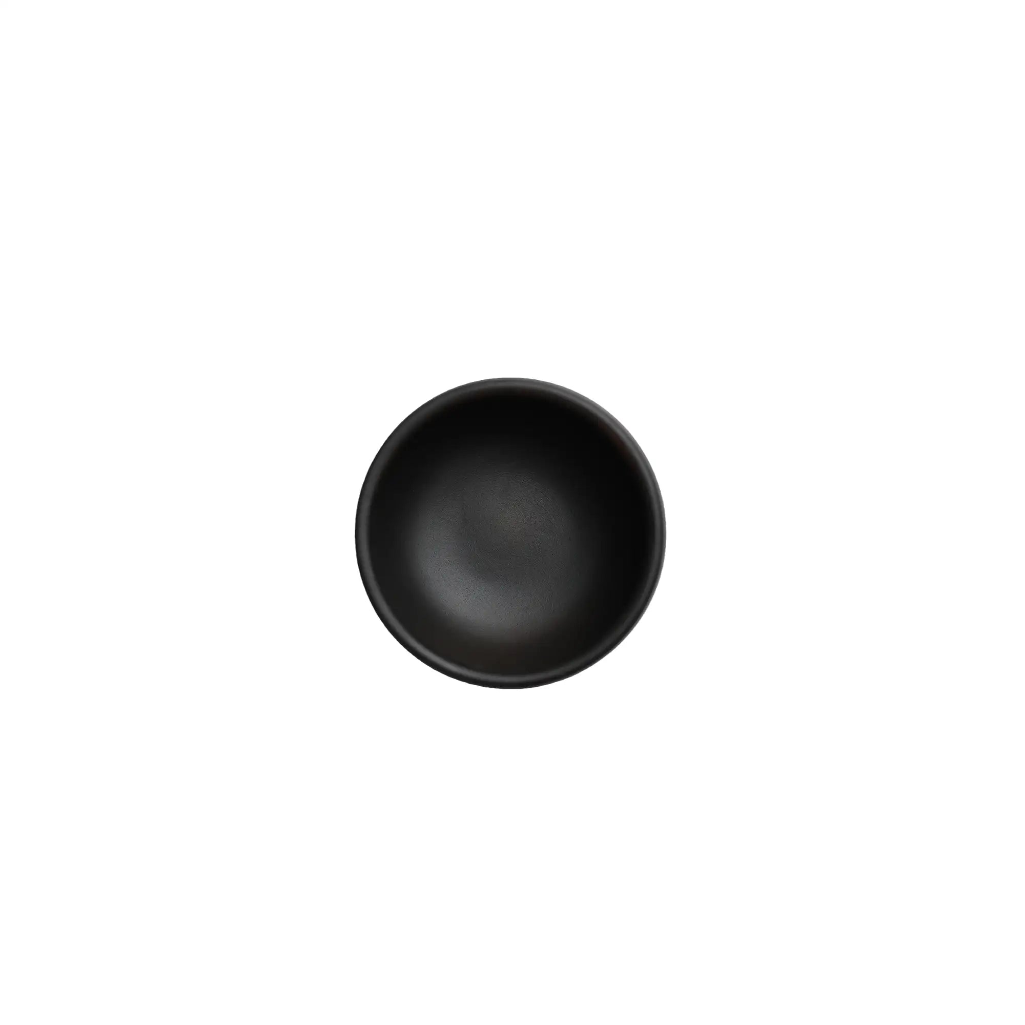 Top view of a Jianshui zitao tea cup with a smooth interior and black matte glaze