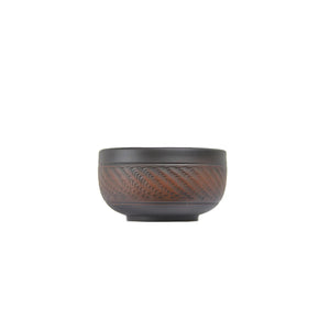 Handcrafted Jianshui tea cup with a chattering-carved texture and compact form
