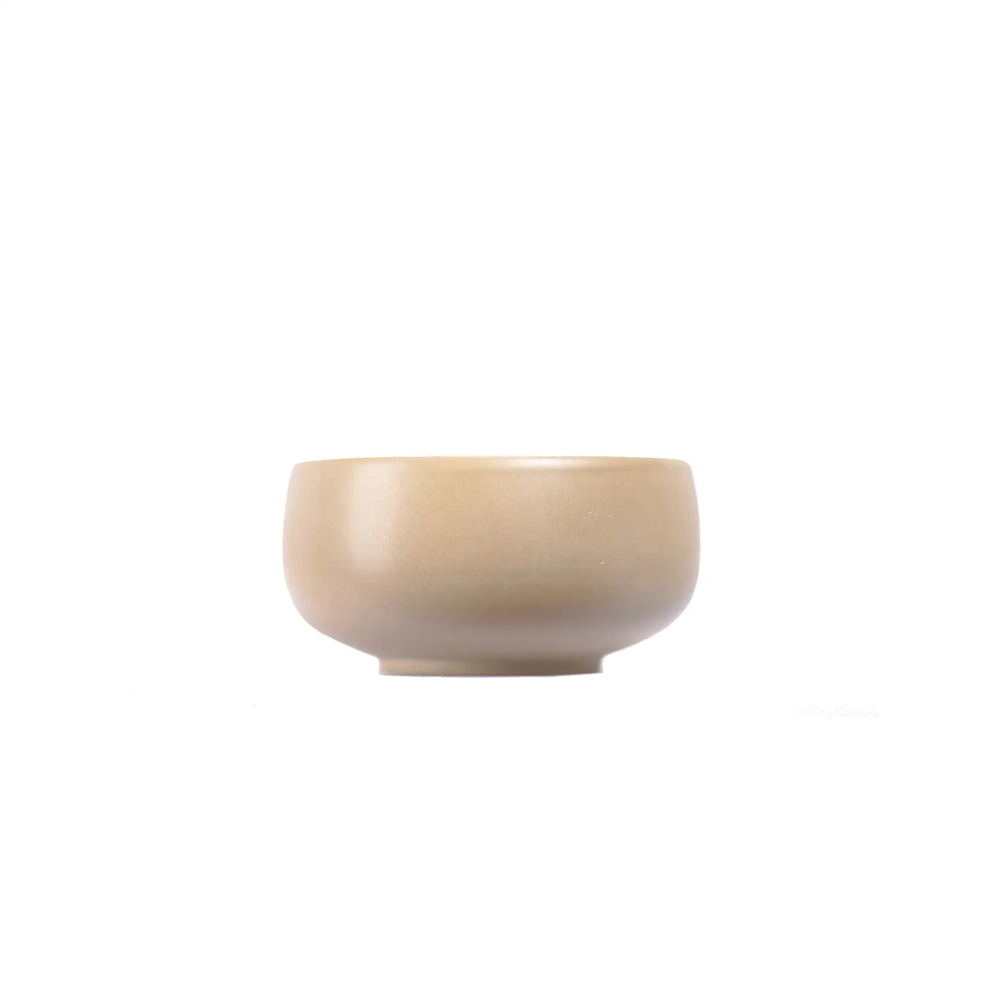 Small light-toned Jianshui zitao teacup with a smooth, unglazed finish and minimalist design
