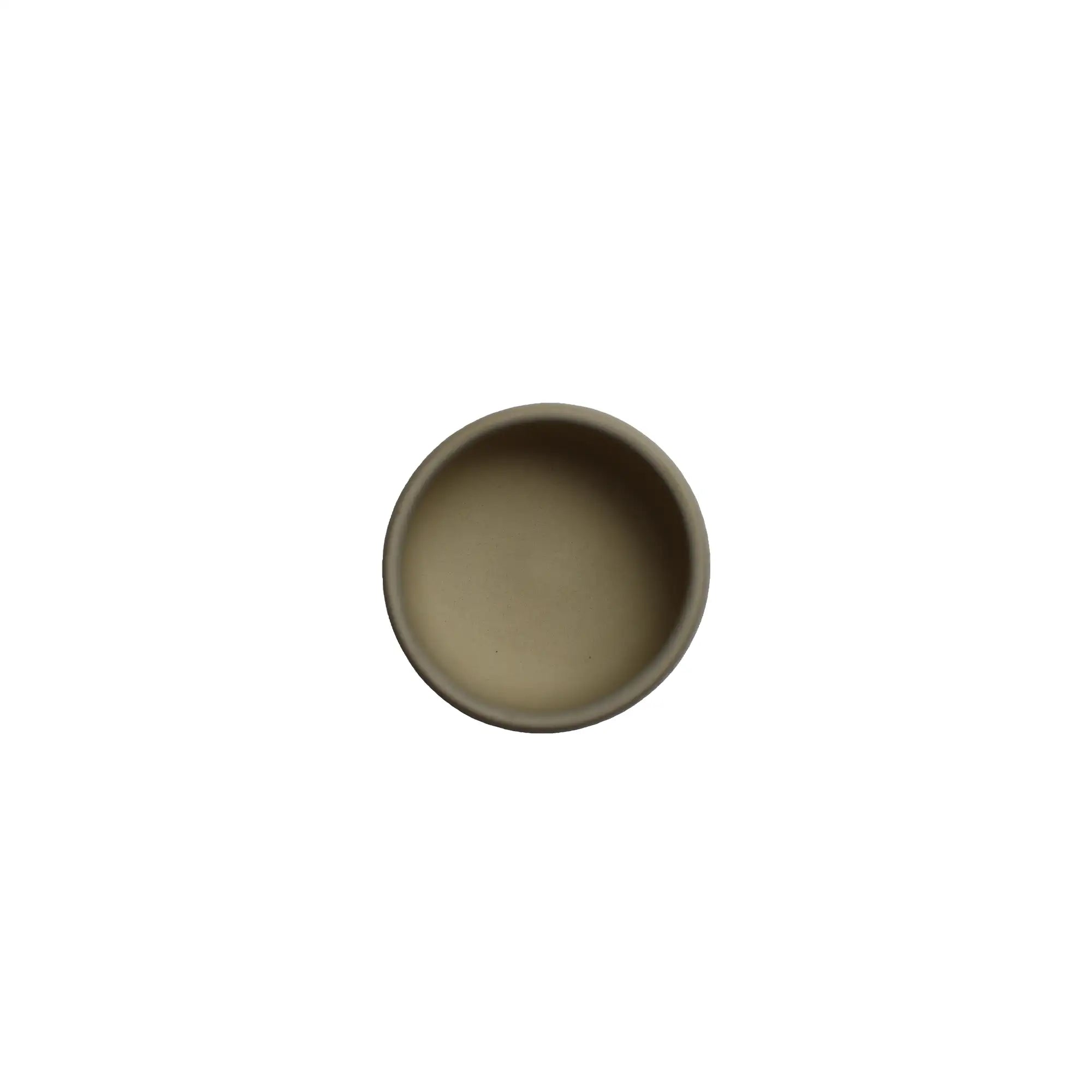 Top view of a small light-toned Jianshui zitao teacup, showing its smooth, unglazed interior