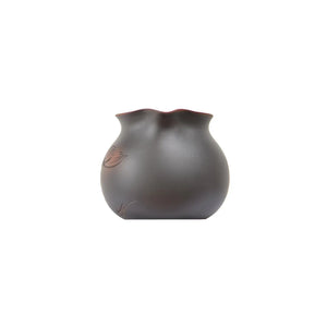 Front view of a Jianshui zitao fairness pitcher (gongdao cup) highlighting the pouring spout and balanced silhouette