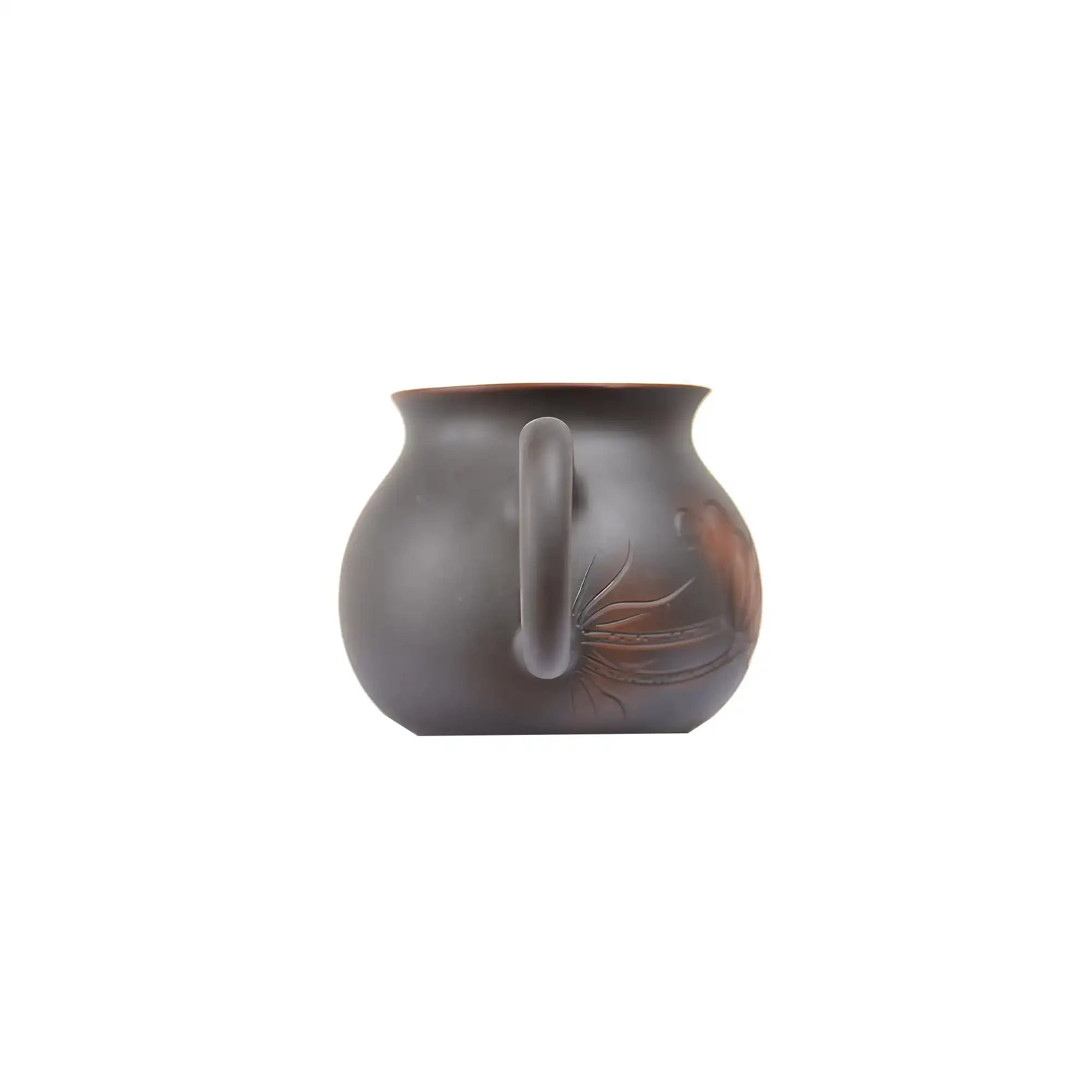 Back view of a Jianshui zitao fairness pitcher (gongdao cup) with a smooth unglazed matte surface and gently curved handle